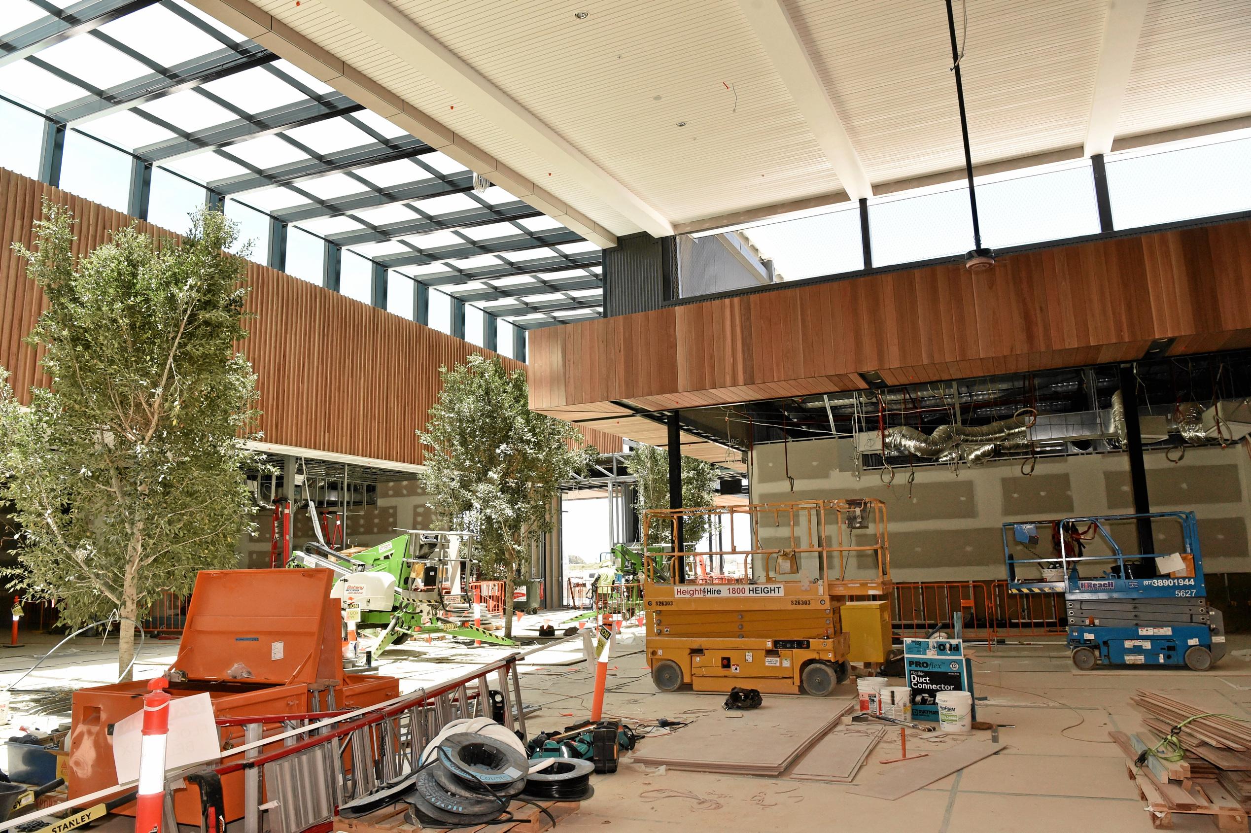 Full steam ahead for the opening of the Stockland Birtinya Shopping Centre. Constuction workers put the final pieces together for the grand opening in a couple of weeks. Picture: Warren Lynam