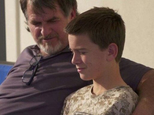 Devin Langford is consoled by his father, David. Picture: ABC News