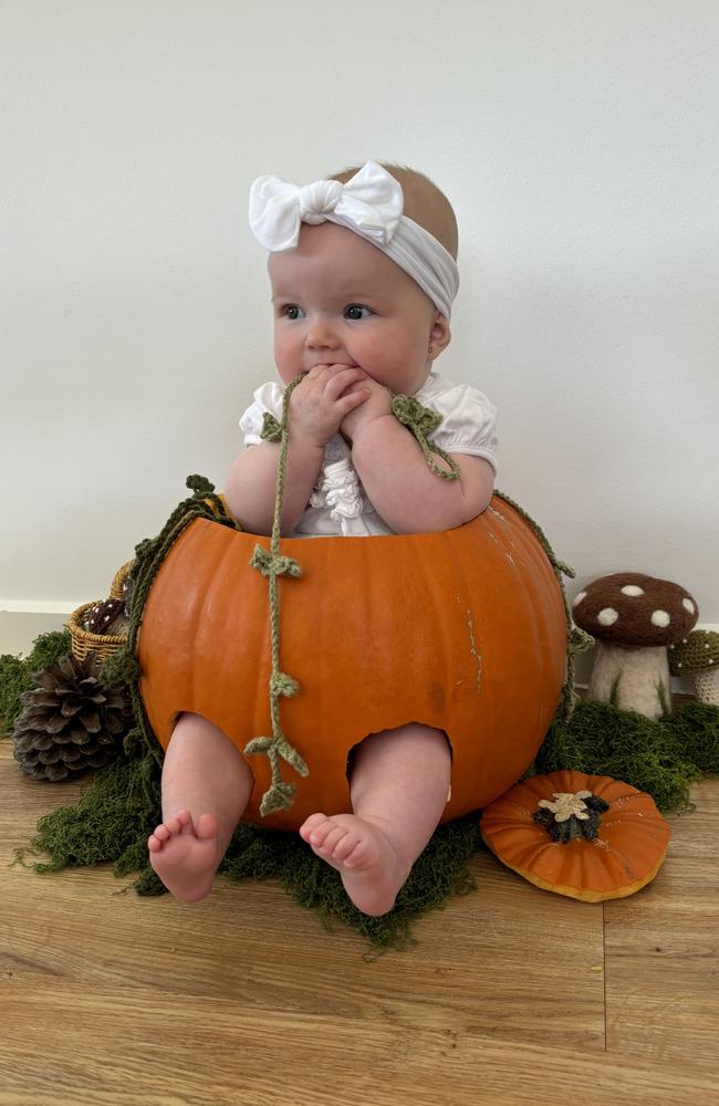 Elaina, four months, dressed as a pumpkin.