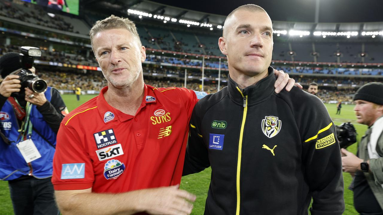 NCA. MELBOURNE, AUSTRALIA. August 24, 2024. AFL Round 24. Richmond vs Gold Coast Suns at the MCG. Richmonds Dustin Martin hugs old coach Damien Hardwick on the MCG during his lap of honour . Pic: Michael Klein