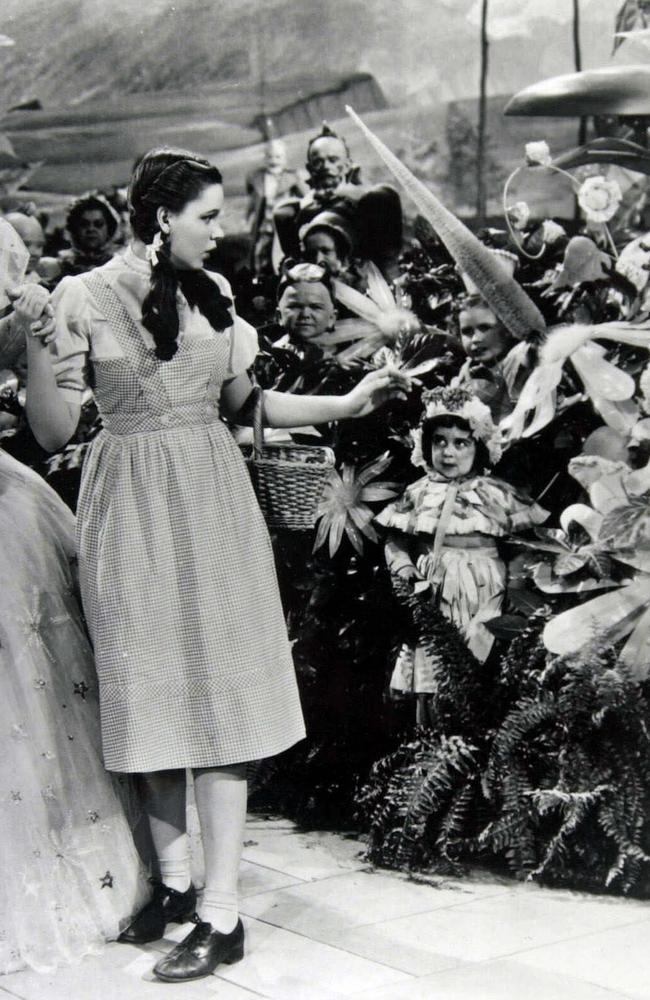 Judy Garland, then aged 16, greets the munchkins in The Wizard of Oz. Picture: Supplied