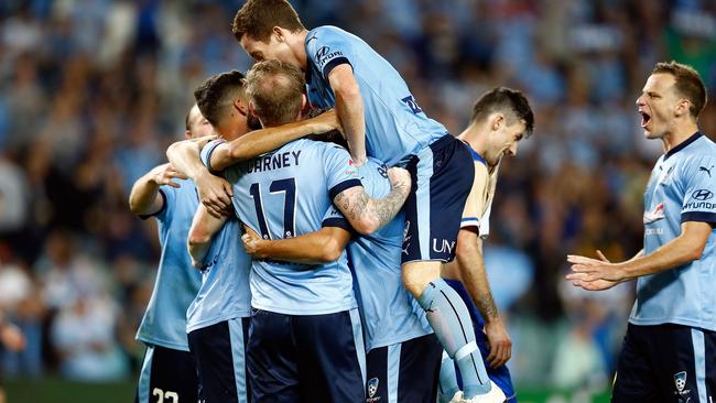 Sydney FC celebrates after scoring a goal.