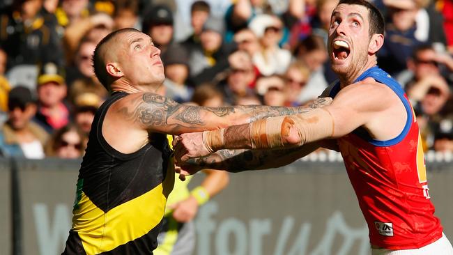 MELBOURNE, AUSTRALIA - APRIL 14:  Dustin Martin of the Tigers and Darcy Gardiner of the Lions compete during the round four AFL match between the Richmond Tigers and the Brisbane Lions at Melbourne Cricket Ground on April 14, 2018 in Melbourne, Australia.  (Photo by Darrian Traynor/Getty Images)