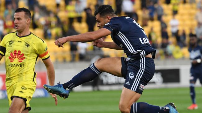 Andrew Nabbout of the Melbourne Victory attempts against shot on goal past Steven Taylor of the Phoenix during the Round 23 A-League match between Wellington Phoenix and Melbourne Victory at Westpac Stadium in Wellington, Sunday, March 15, 2020. (AAP Image/Ross Setford) NO ARCHIVING, EDITORIAL USE ONLY