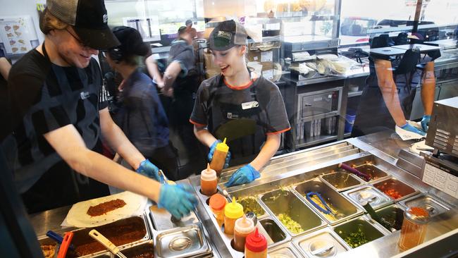 Taco Bell staff in Annerley. Taco Bell is expanding to North Lakes. (AAP Image/Claudia Baxter)