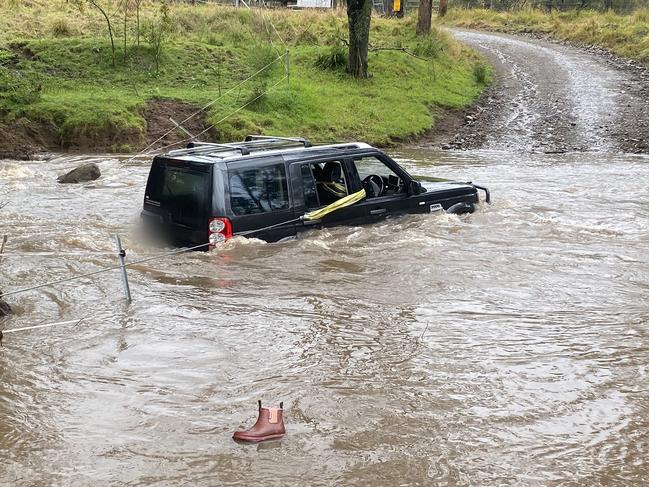 Three people were rescued by a police officer after they became trapped in their car by floodwaters in the state’s Hunter Region today. Picture: PMU