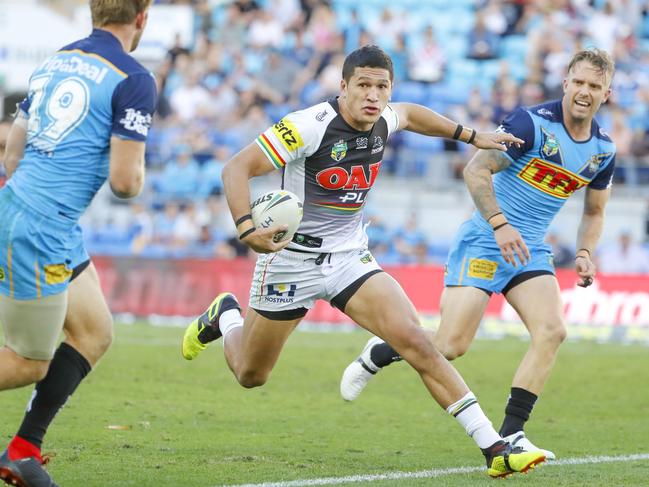 Dallin Watene-Zelezniak of the Panthers (centre) runs with the ball during the Round 22 NRL match between the Gold Coast Titans and the Penrith Panthers at Cbus Super Stadium on the Gold Coast, Saturday, August 11, 2018. Picture: AAP Image/Glenn Hunt