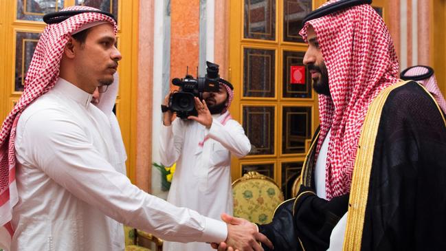 One of Jamal Khashoggi’s sons with Saudi Crown Prince Mohammed bin Salman. Picture: AP