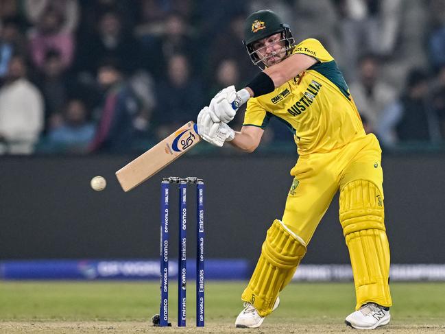 TOPSHOT - Australia's Josh Inglis plays a shot during the ICC Champions Trophy one-day international (ODI) cricket match between Australia and England at the Gaddafi Stadium in Lahore on February 22, 2025. (Photo by Aamir QURESHI / AFP)