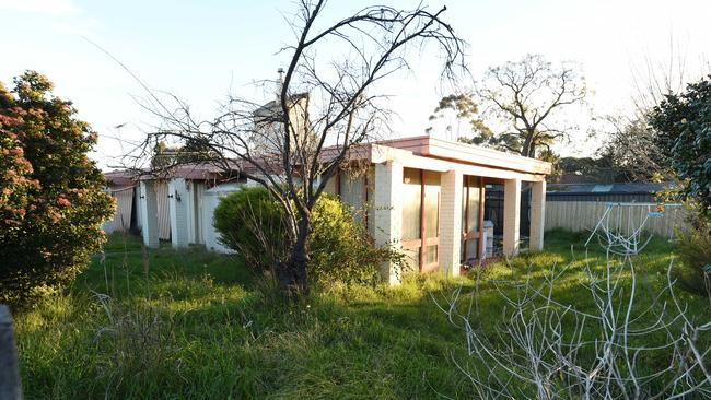 The rundown house at Greenridge Ave.