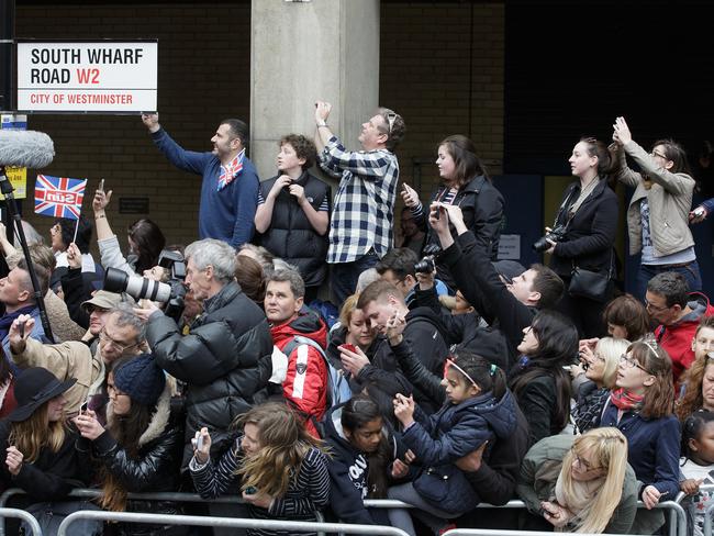 Members of the public try to catch a glimpse of Britain's Prince William and Kate, Duchess of Cambridge and their newborn baby princess as they are about to leave St. Mary's Hospital's exclusive Lindo Wing in London, Saturday, May 2, 2015. (AP Photo/Tim Ireland)