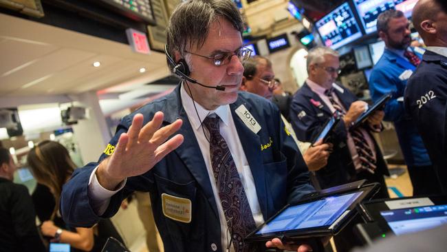 NEW YORK, NY - OCTOBER 21: Traders work on the floor of the New York Stock Exchange after Ferrari Automotive Company's IPO on October 21, 2015 in New York City. Ferrari will trade under the symbol RACE. Andrew Burton/Getty Images/AFP == FOR NEWSPAPERS, INTERNET, TELCOS & TELEVISION USE ONLY ==