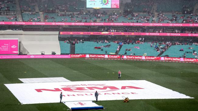 An all too common sight in recent years: the SCG Test being hammered by mother nature. Picture: AFP