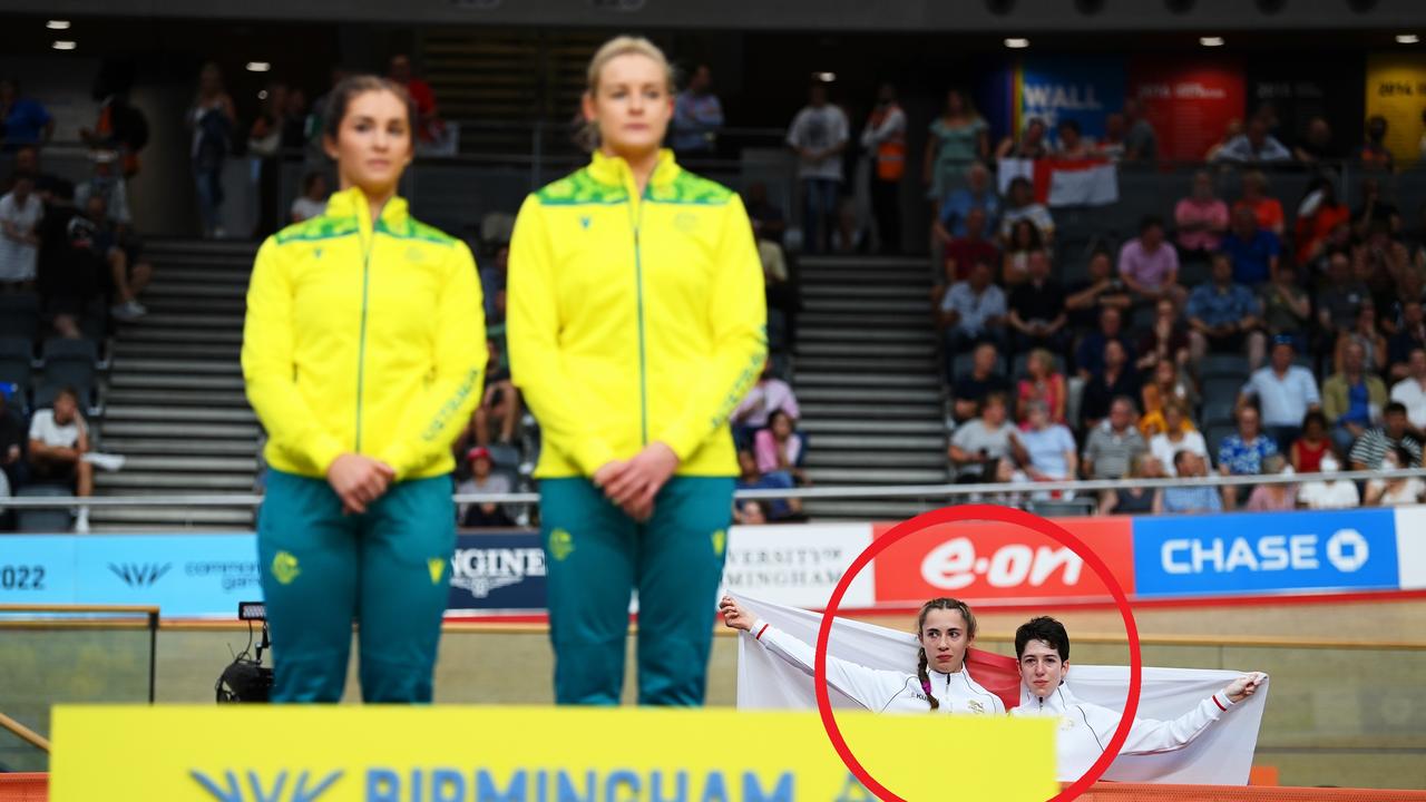 Bronze Medalists, Sophie Unwin and Georgia Holt of Team England stand with their flag behind the podium. Photo by Justin Setterfield/Getty Images.