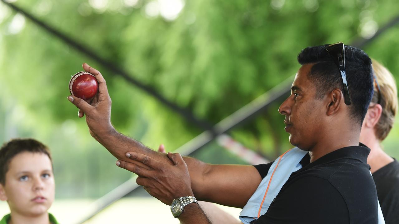 Tom Menzies (left) gets some tips from Sri Lankan paceman Chaminda Vaas in 2016. Picture: File.