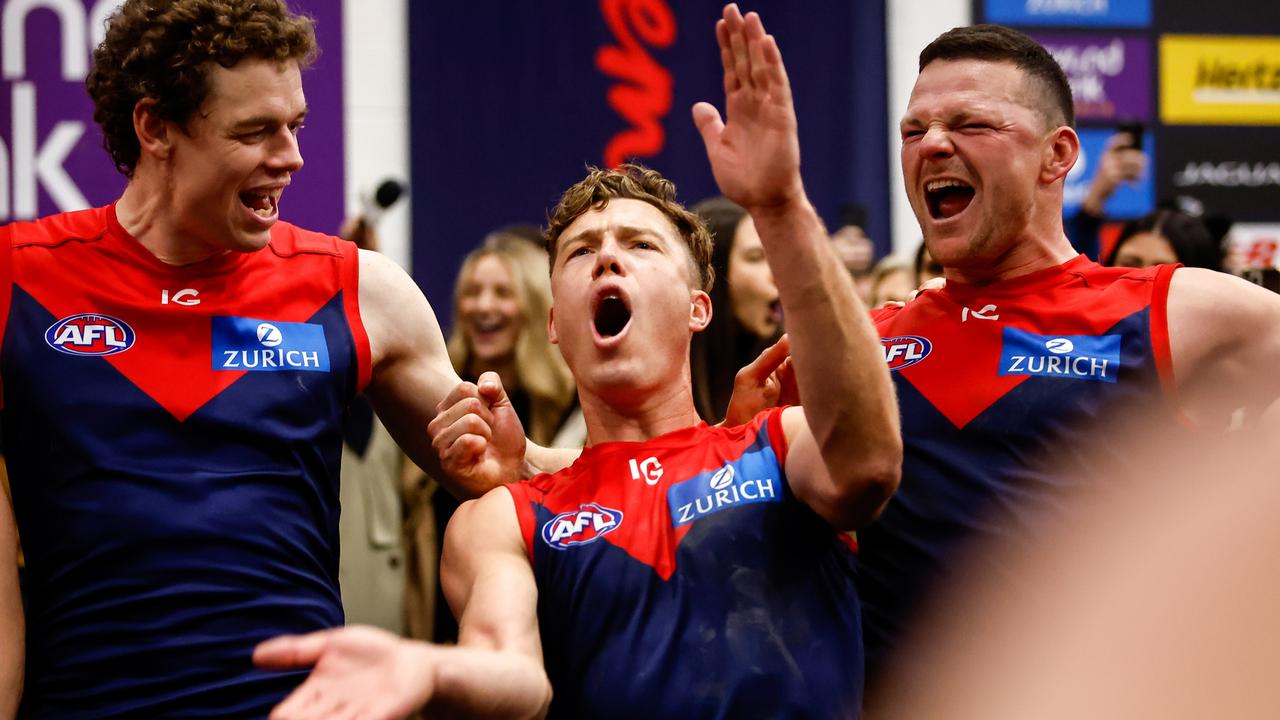 Jake Melksham, Steven May and Ben Brown celebrate the thrilling win. Picture: Dylan Burns/AFL Photos