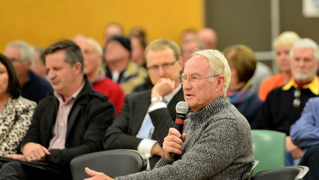 Former mayor Mr I.M. Brooks addresses the panel as residents gather at Clapham Primary School to discuss Mitcham Council's consideration to build a Bunnings store on Goodwood Rd. Picture: Bianca De Marchi