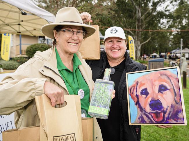Marie Stuart (left) and Lisa Hayward show their purchases supporting local businesses at the Hampton Festival, Saturday, May 17, 2025. Picture: Kevin Farmer