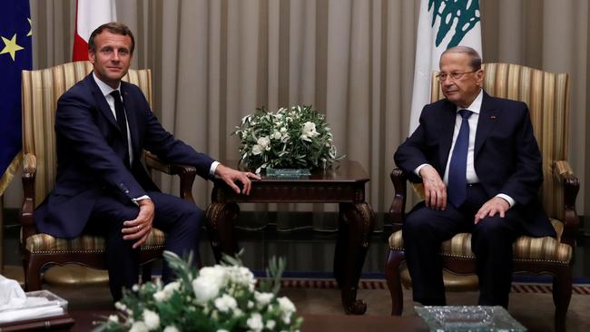 French President Emmanuel Macron and Lebanese President Michel Aoun at Beirut International airport on September 22. Picture: AFP