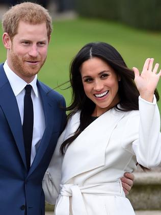 The happy couple smile for the cameras. Picture: Eddie Mulholland/Pool via AP