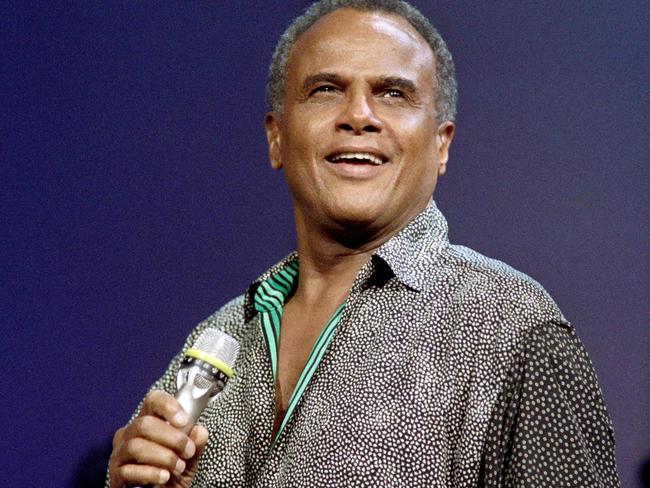 (FILES) In this file photo taken on September 24, 1988, US singer and civil rights activist Harry Belafonte performs in Paris. - Belafonte, the superstar entertainer who introduced a Caribbean flair to mainstream US music and became well known for his deep personal investment in civil rights, died Pail 25, 2023, in Manhattan, US media reported. He was 96. (Photo by AFP)