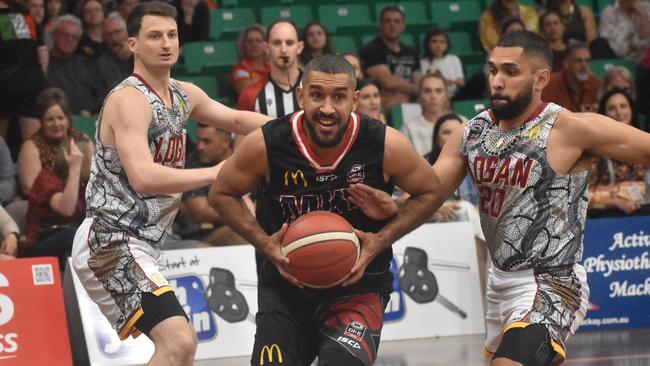 Chris Cedar for the Mackay Meteors gets past brother Michael Cedar for Logan Thunder, July 18, 2021. Picture: Matthew Forrest