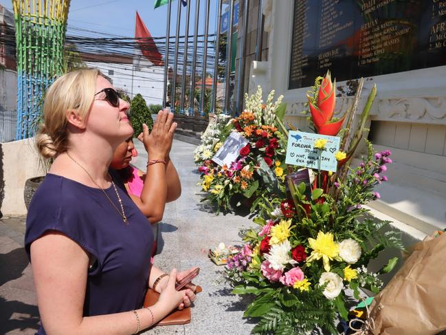 Australian Natalie Juniardi with her son and relative visit the memorial in Legian, Kuta. Picture. Lukman S. Bintoro