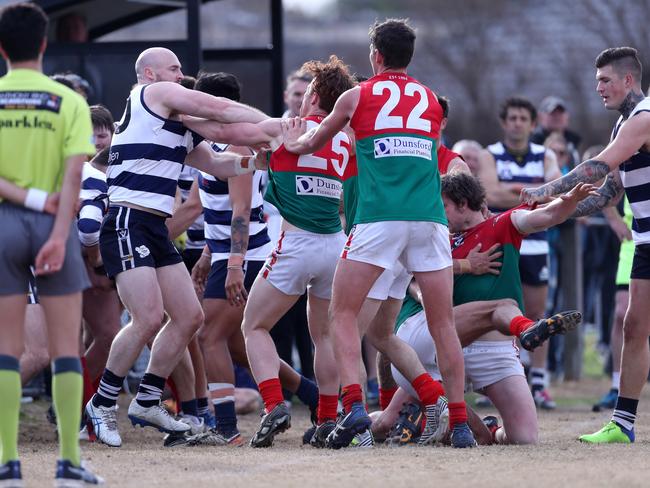 An all in brawl starts after Joshua Tripcony of Chelsea was pushed in to the fence by Beau Hendry of the Pines, Trent Stynes of Chelsea and Reece Stewart of Pines wrestle during the Peninsula FL match between Chelsea and Pines played at Chelsea Reserve on Saturday 12th August, 2017. Picture: Mark Dadswell