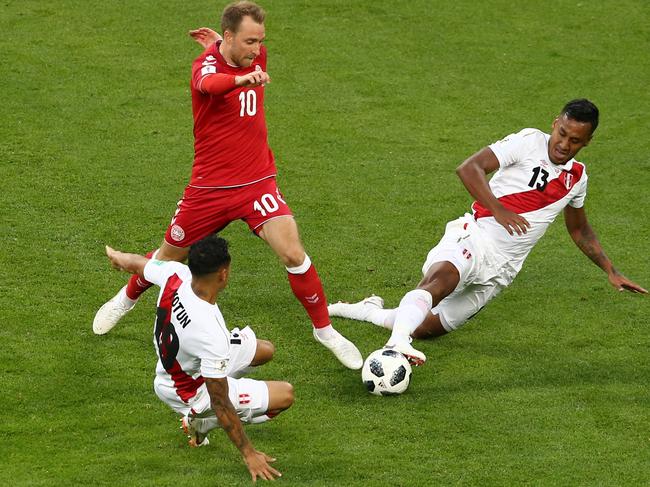 Peru double their efforts to stop Christian Eriksen. Picture: Getty Images