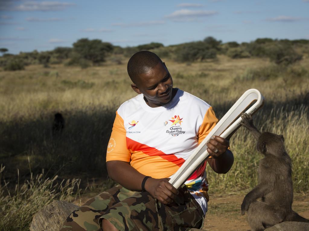 The Queen’s Baton took part in events in the capital Windhoek and in rural Namibia on April 29, 2017, the second and last full day’s programme, including a visit to young athletes at a shopping mall and to an animal sanctuary. This Queen’s Baton Relay will visit all 70 nations and territories of the Commonwealth, over 388 days and cover 230,000km. It will be the longest Relay in Commonwealth Games history, finishing at the Opening Ceremony on the Gold Coast on 4th April 2018. Photograph shows one of the bearers with a young baboon during a visit by the Baton to Naankuse wildlife sanctuary.