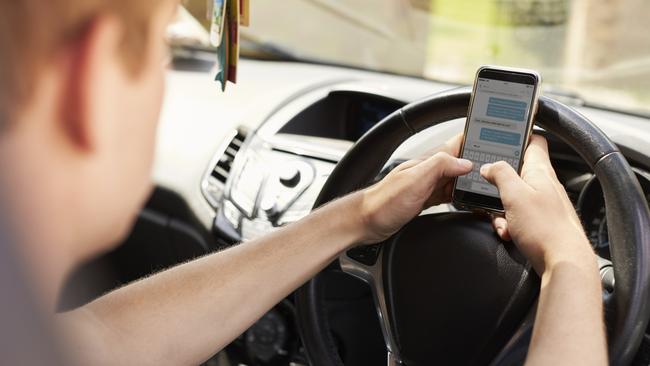 More than 30 per cent of Queenslanders admit to using their mobile phone while driving.