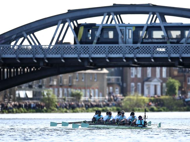 Cambridge University men's team compete in the 169th men's boat race against Oxford University on the River Thames in London on March 30, 2024. The Boat Race was first raced by crews from Oxford and Cambridge University in 1829 and is now one of the world's oldest and most famous amateur sporting events. (Photo by HENRY NICHOLLS / AFP)