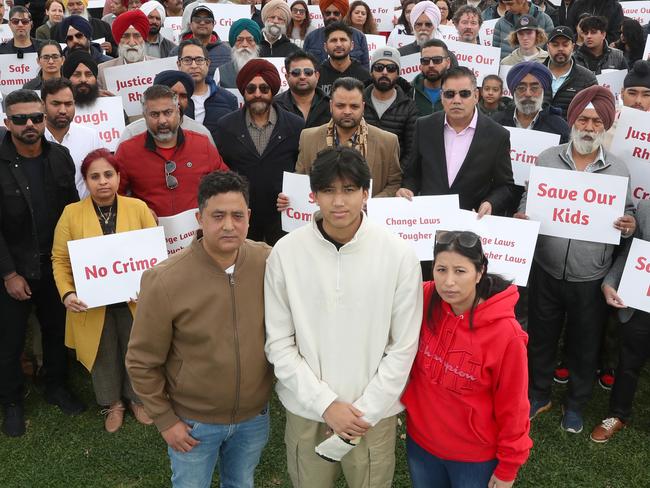 Hundreds of people have gathered at a rally to support Tarneit teenager Rhyan Singh to call for tougher youth crime laws after he was brutally stabbed in a random attack in a Tarneit park. L to R father- Rajiv Singh, Rhyan Singh and mother Sushma Manandhar. Picture: David Crosling