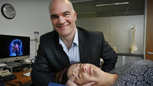 Cindy Stephenson with Melborune Headache Centre headache consultant and director Roger O'Toole. Picture: David Caird