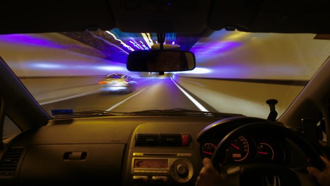 The tunnel of the AirportlinkM7 is seen through the front windscreen of a motorist's car. Picture: AAP