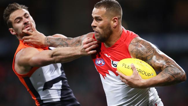 Lance Franklin fends off Giant Stephen Coniglio last month. Picture: AAP Image/Brendon Thorne