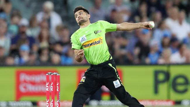 ADELAIDE, AUSTRALIA - DECEMBER 20:  Fazalhaq Farooqi of the Thunder  during the Men's Big Bash League match between the Adelaide Strikers and the Sydney Thunder at Adelaide Oval, on December 20, 2022, in Adelaide, Australia. (Photo by Sarah Reed/Getty Images)