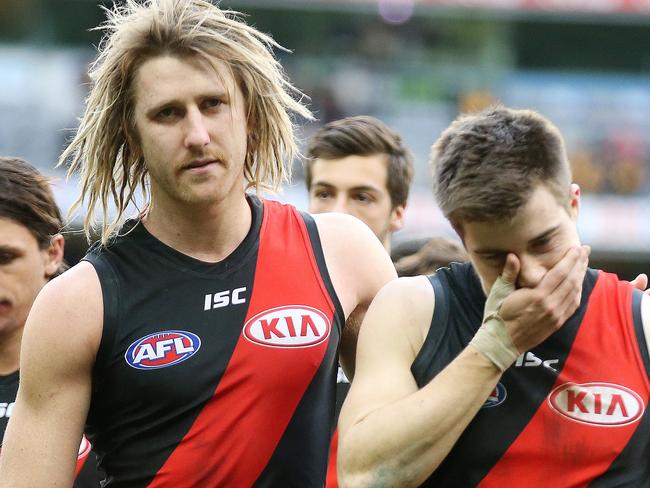 AFL Round 20. 04/08/2018. Hawthorn v Essendon at the MCG.  Essendon skipper Dyson Heppell and Zach Merrett lead the Bombers off the MCG  .Pic: Michael Klein