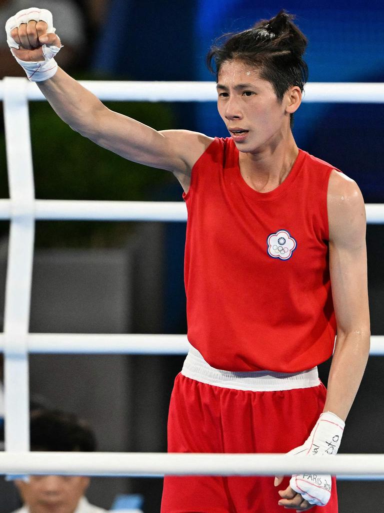 The duo won the gold in their weight divisions. (Photo by MOHD RASFAN / AFP)