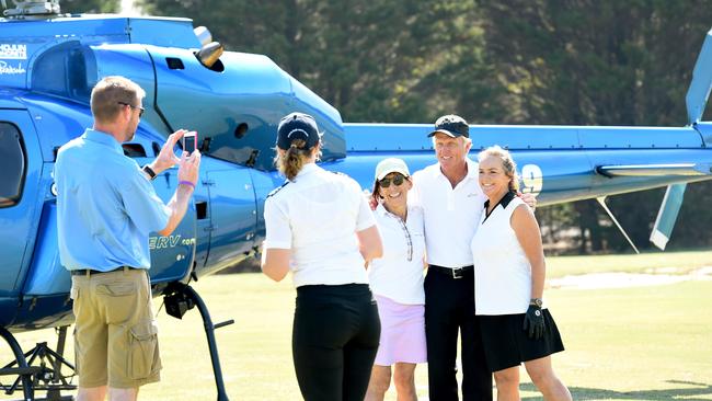 Greg Norman gets a snap with fans before leaving Royal Melbourne Golf Course. Picture: Mike Keating.