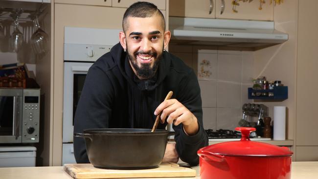 <s1>Zakh Hussein decided to cook and give food to the homeless instead of going out, with the meals shown inset.</s1>                        <source> Picture: Robert Pozo</source>