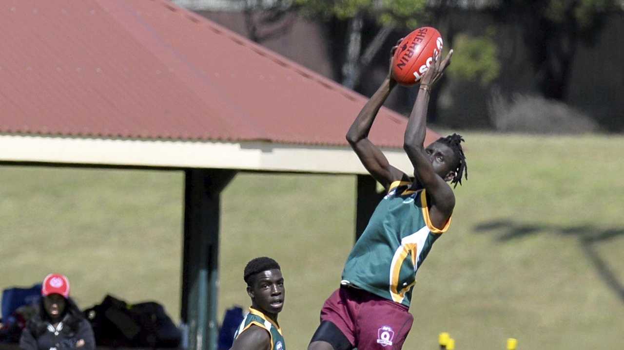 Sibit Mach takes a mark for Centenary Heights State High School in the Darling Downs qualifiers. Picture: Kevin Farmer