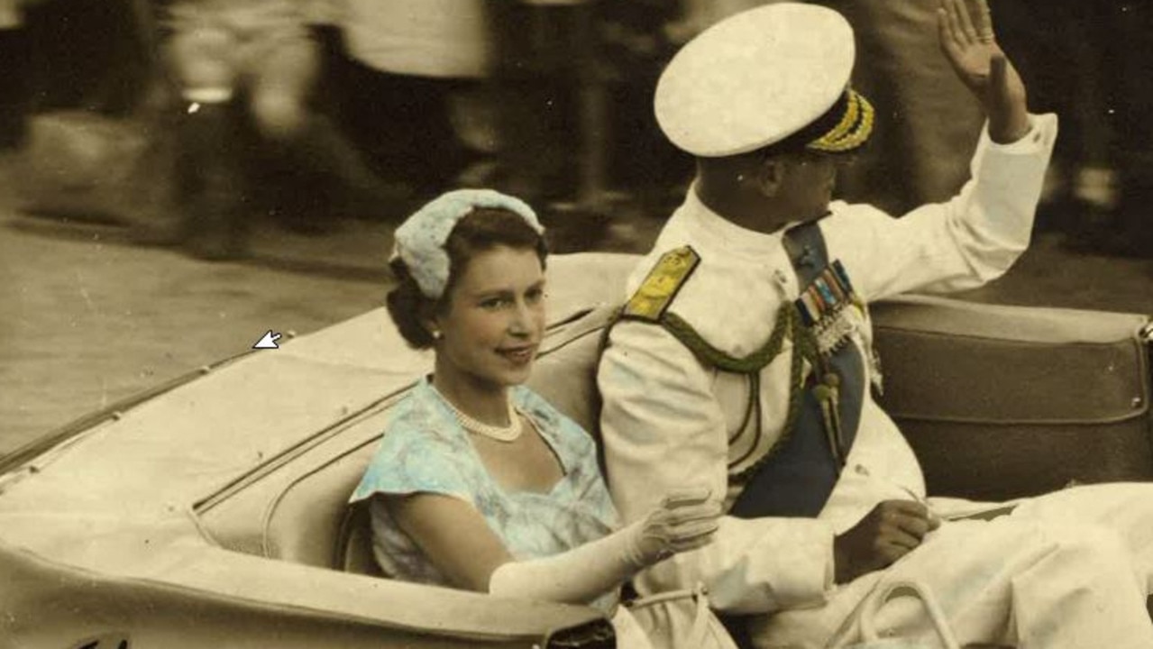 Queen Elizabeth and Prince Philip drive through the streets of Brisbane during their 1954 Australian tour.