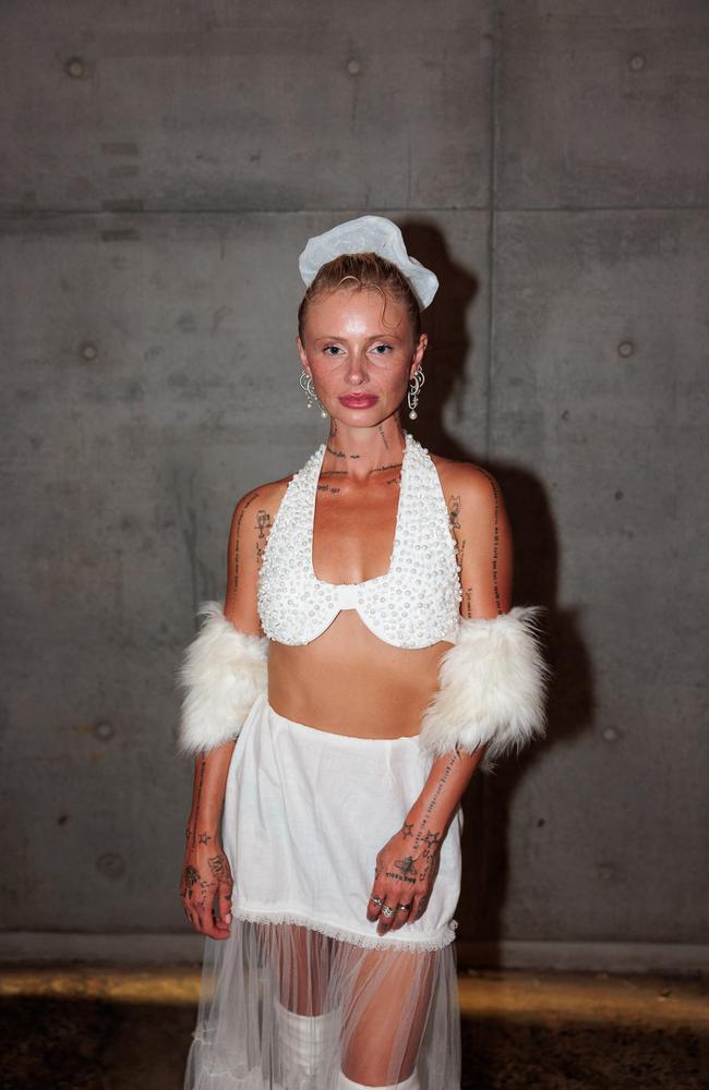 The singer wore a white bedazzled bra with a matching mini skirt and accessories. Picture: Matrix