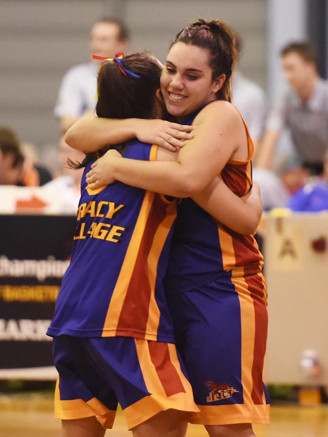 Jets sisters Abby and Demi Cubillo embrace after beating Eagles in a DBA Grand Final in December, 2014. Picture: HELEN ORR