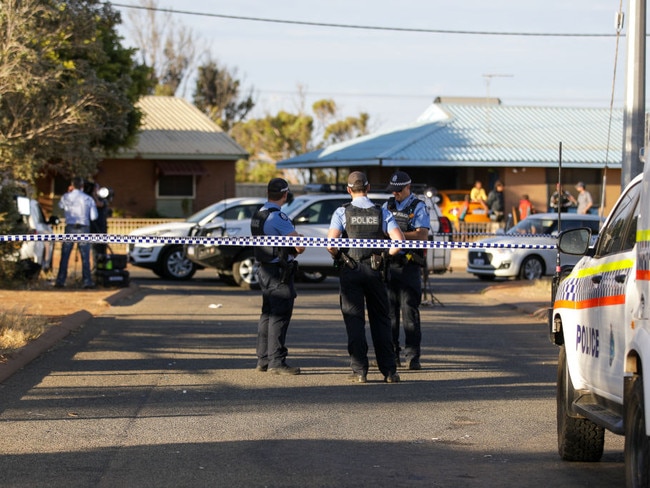 CARNARVON, AUSTRALIA - NOVEMBER 3: Police officers stand on patrol outside the house where four-year-old Cleo Smith was found on November 3.