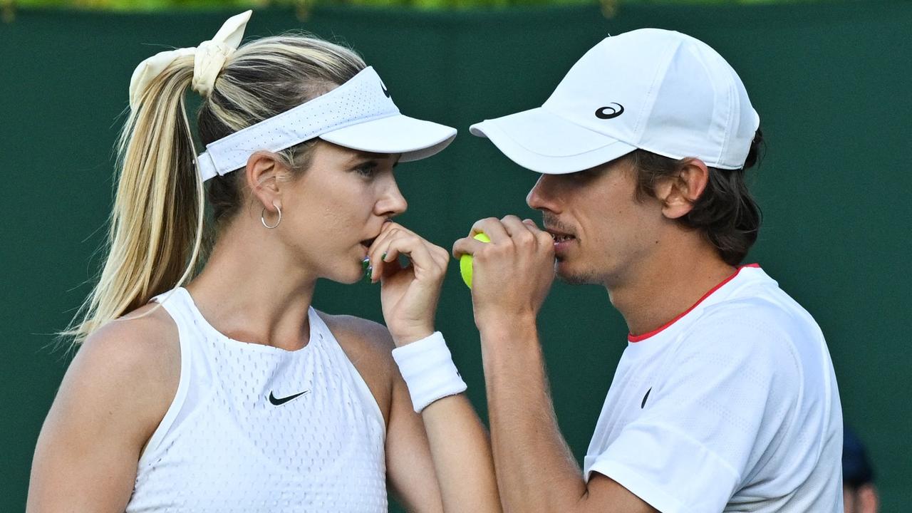 Britain's Katie Boulter (L) speaks Australia's Alex De Minaur during their mixed doubles tennis match against Australia's John Peers and Australia's Storm Hunter on the fifth day of the 2023 Wimbledon Championships at The All England Tennis Club in Wimbledon, southwest London, on July 7, 2023. (Photo by Glyn KIRK / AFP) / RESTRICTED TO EDITORIAL USE