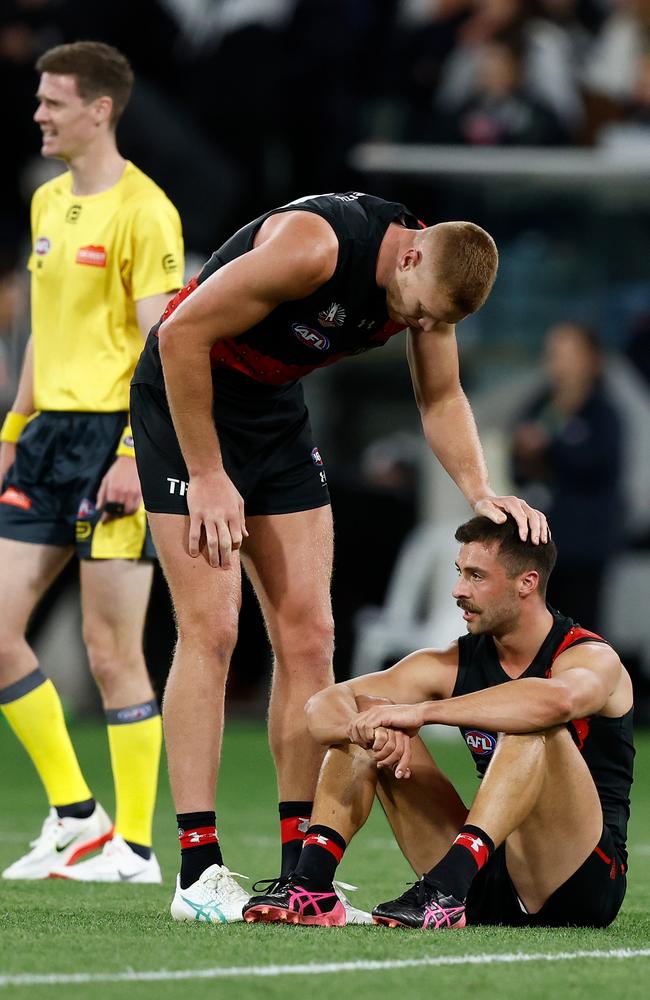 Kyle Langford is comforted by Peter Wright. Picture: Michael Willson/AFL Photos via Getty Images