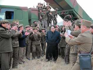 FILE PHOTO: Kim Jong-un, Supreme Commander of the Korean People's Army, meets military personnel during the test-firing of a  rocket. Picture: EPA/KCNA