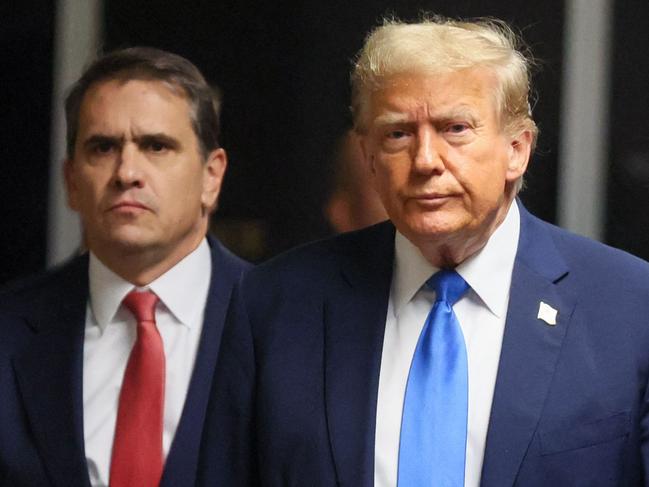 Former US president and Republican presidential candidate Donald Trump, flanked by lawyer Todd Blanche arrives at Manhattan Criminal Court. Picture: AFP